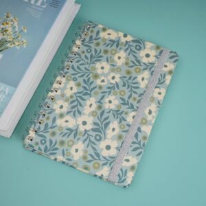 A large notebook decorated with floral drawings.